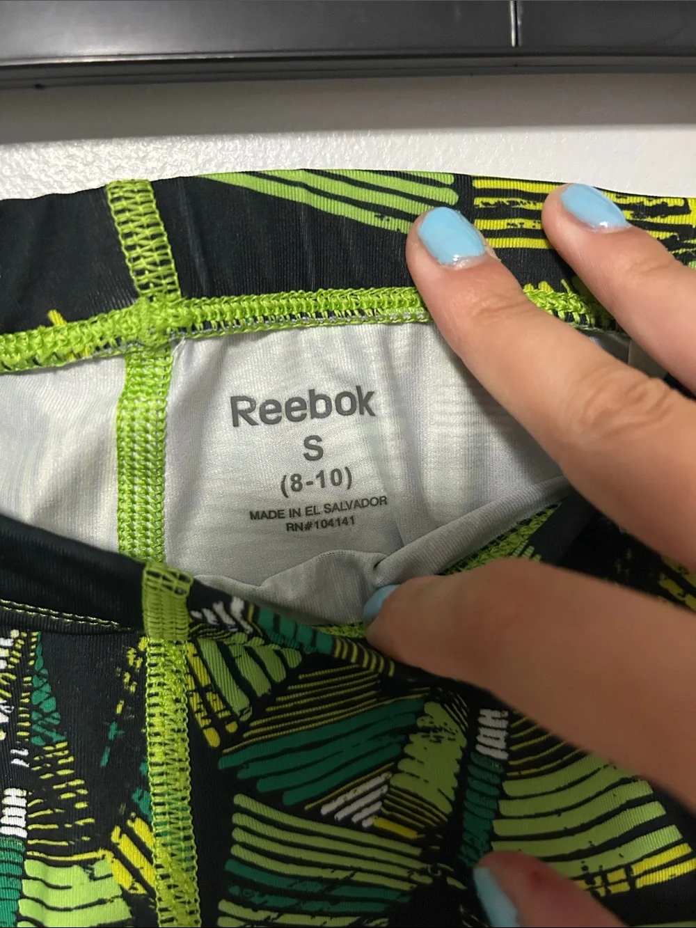 Reebok Men’s Black and Green Geometric Athletic Shorts